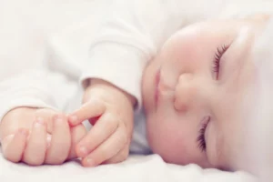close up on a newborn baby's sleeping face