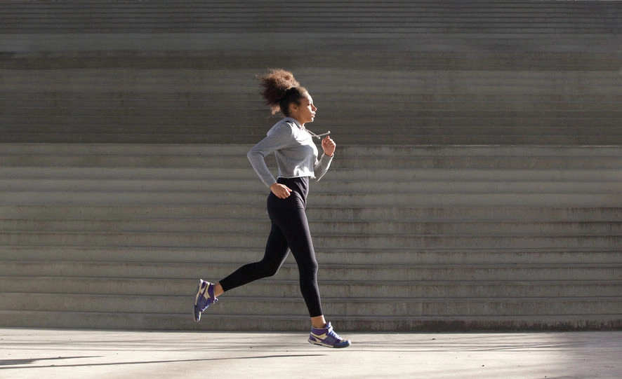 A black woman running for exercise